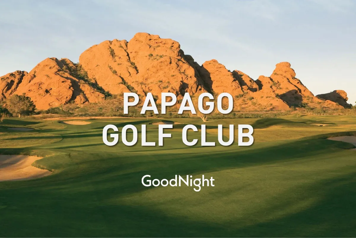 A beautifully maintained golf course stretches out beneath a broad sky, featuring dramatic rock formations at the edges. The lush greens are bathed in warm sunlight, inviting guests to enjoy a round of golf or a tranquil stroll. The open expanse and natural landscape evoke the feeling of a world-class golf destination.