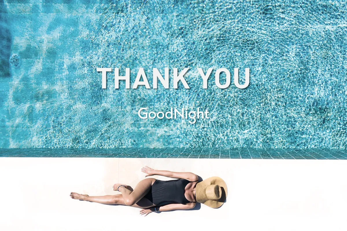 A serene outdoor pool scene featuring a sparkling swimming pool with a person lounging poolside wearing a hat. The atmosphere is tranquil, with soft sunset lighting that enhances the relaxing ambiance.